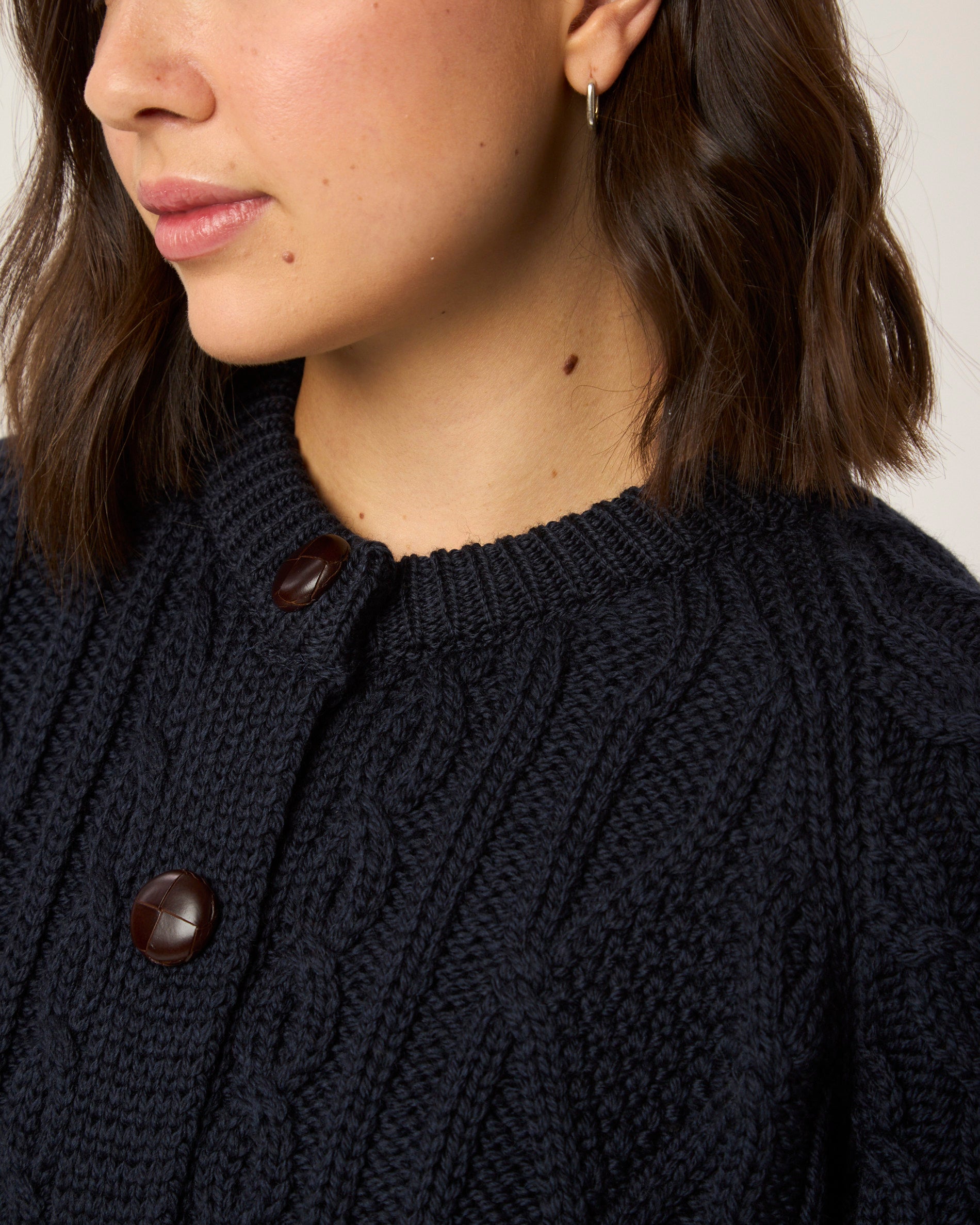 Image of model wearing Beckett Cable Knit Cardigan. 