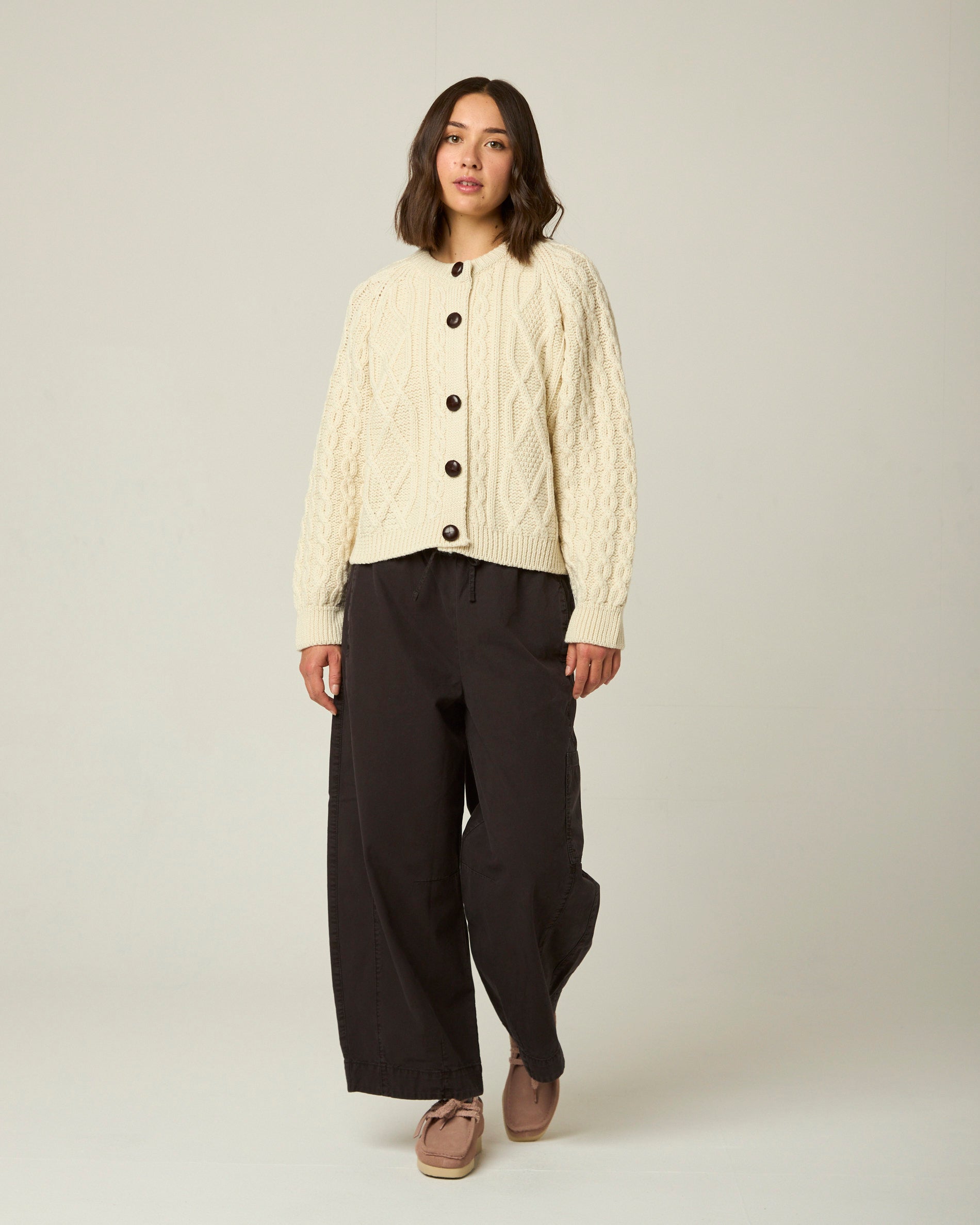 Image of model wearing Beckett Cable Knit Cardigan. 