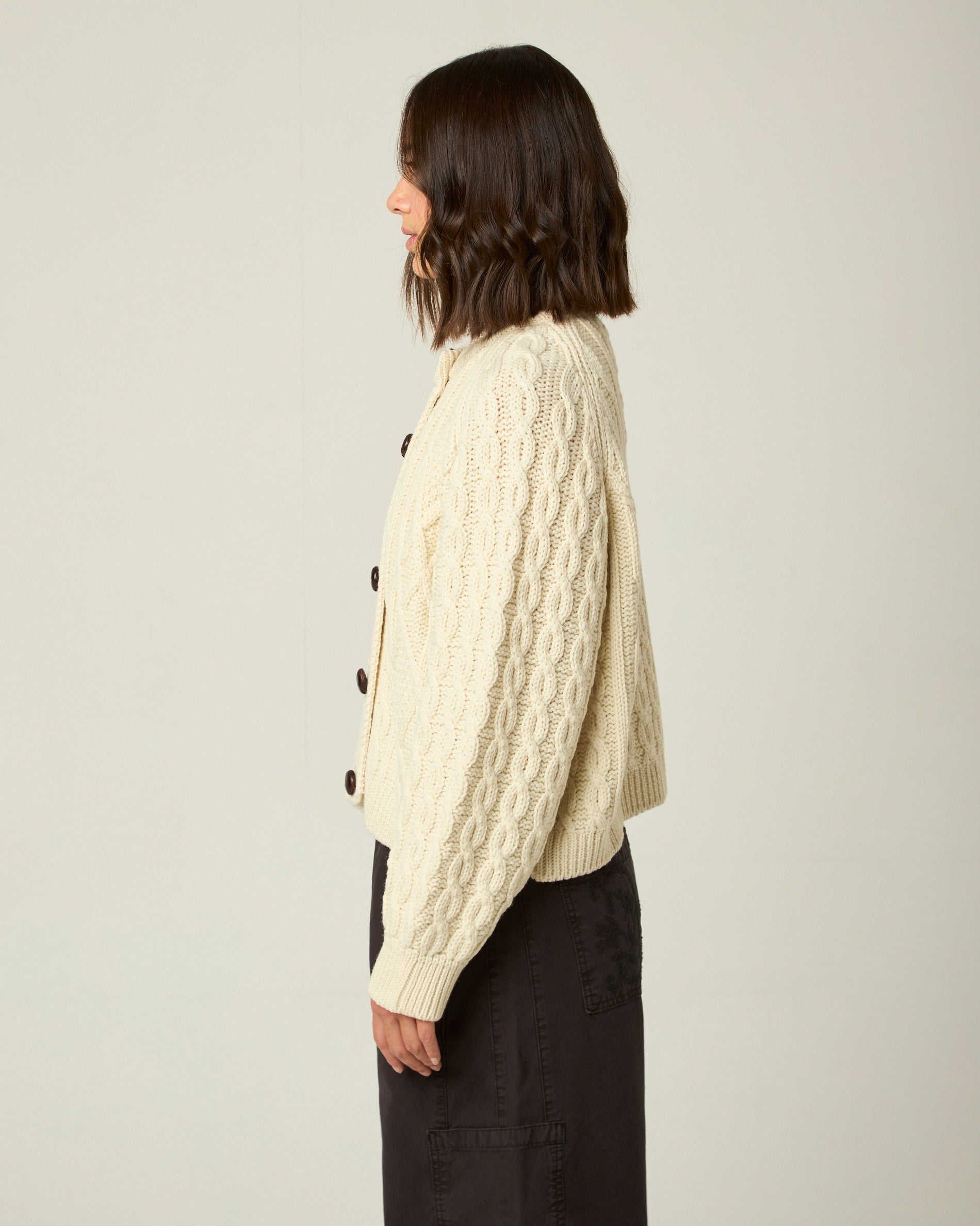 Image of model wearing Beckett Cable Knit Cardigan. 