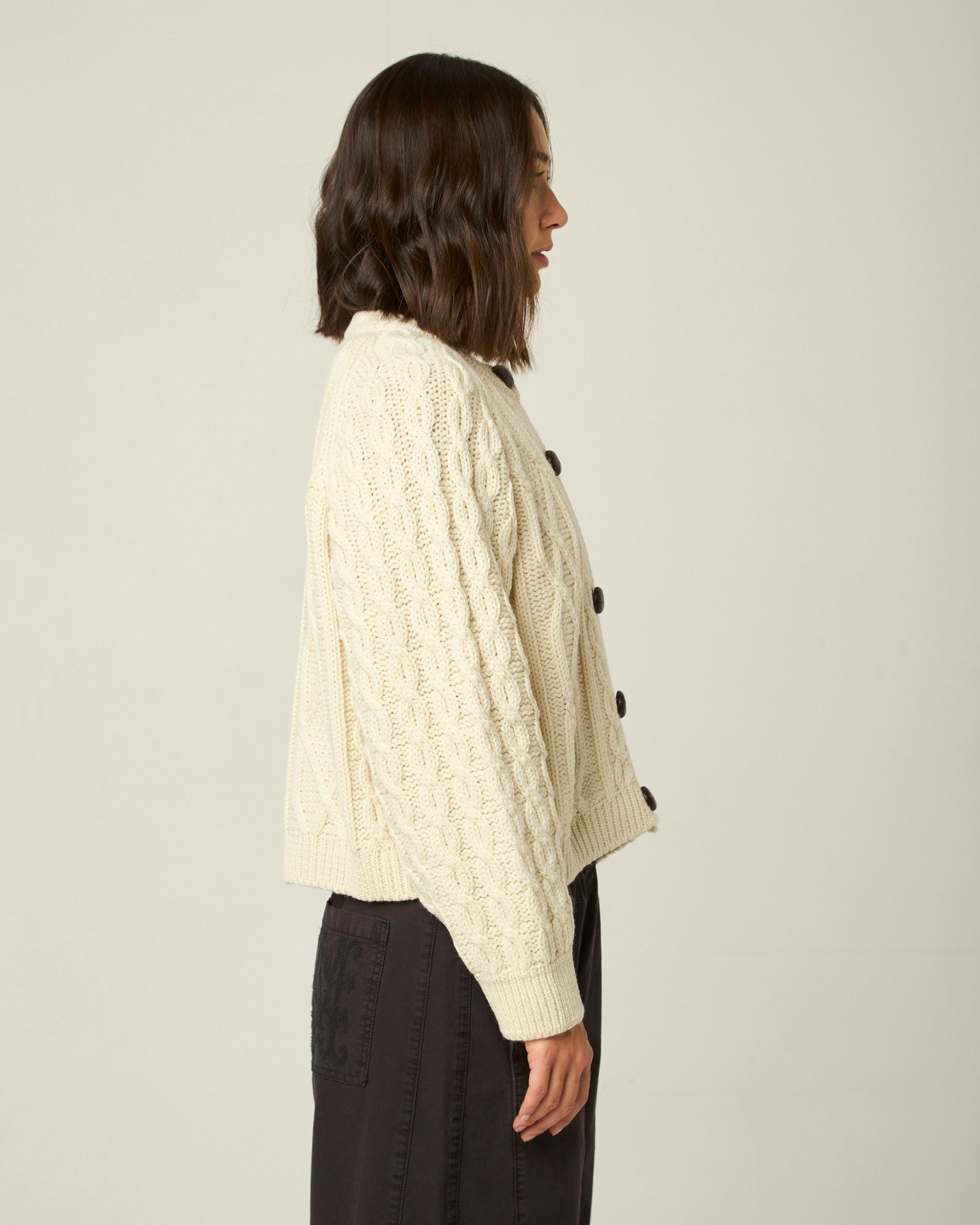 Image of model wearing Beckett Cable Knit Cardigan. 