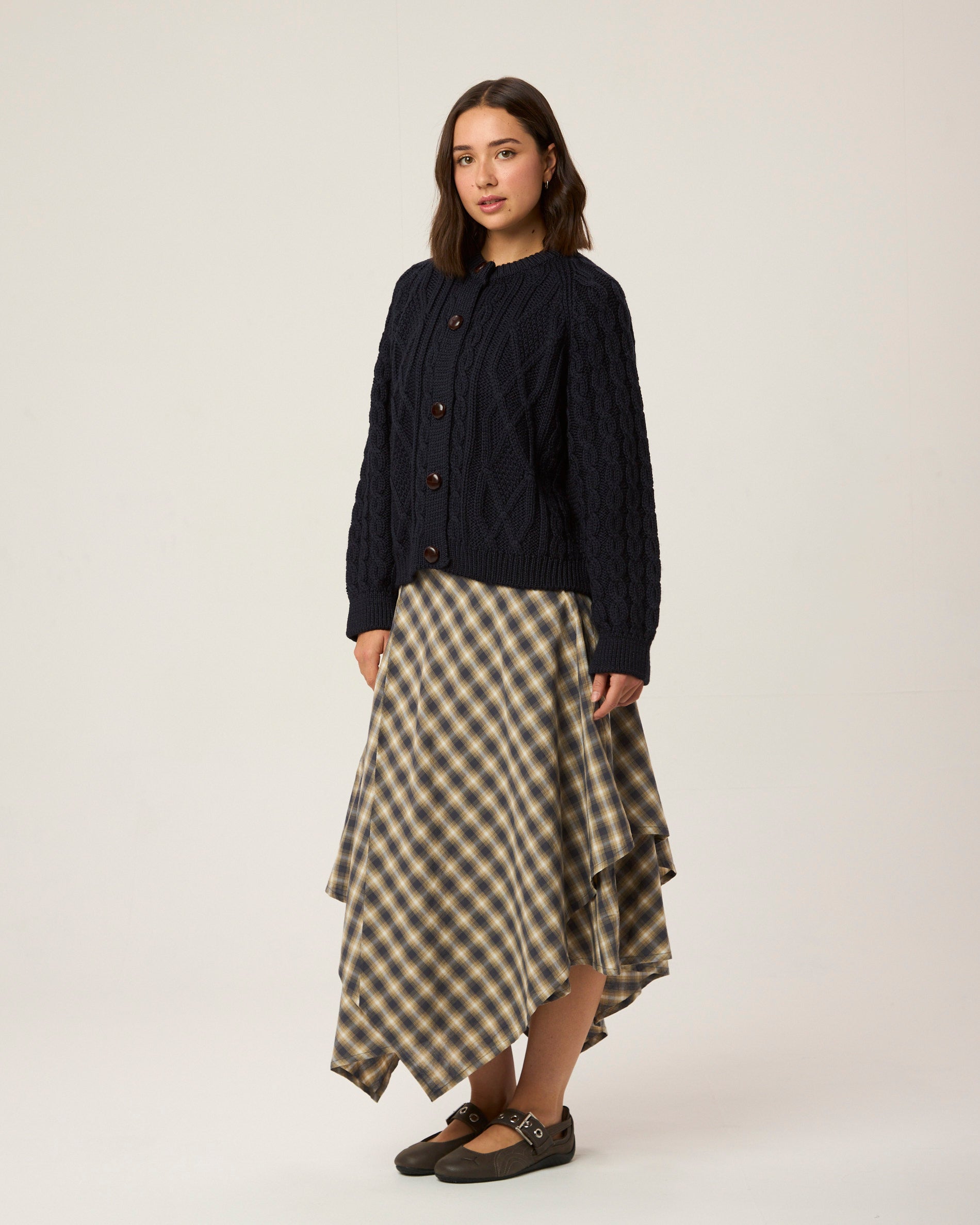 Image of model wearing Beckett Cable Knit Cardigan. 