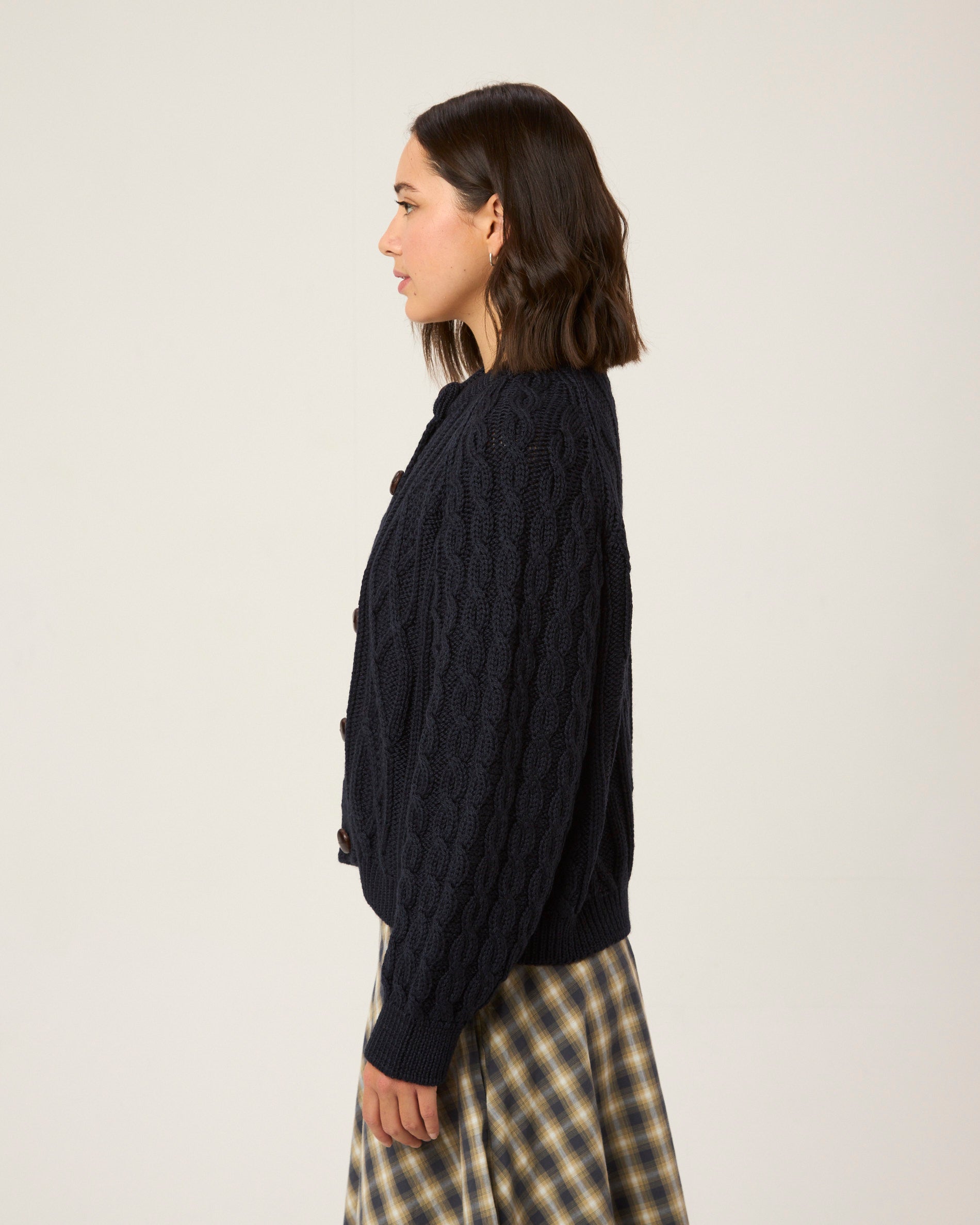 Image of model wearing Beckett Cable Knit Cardigan. 