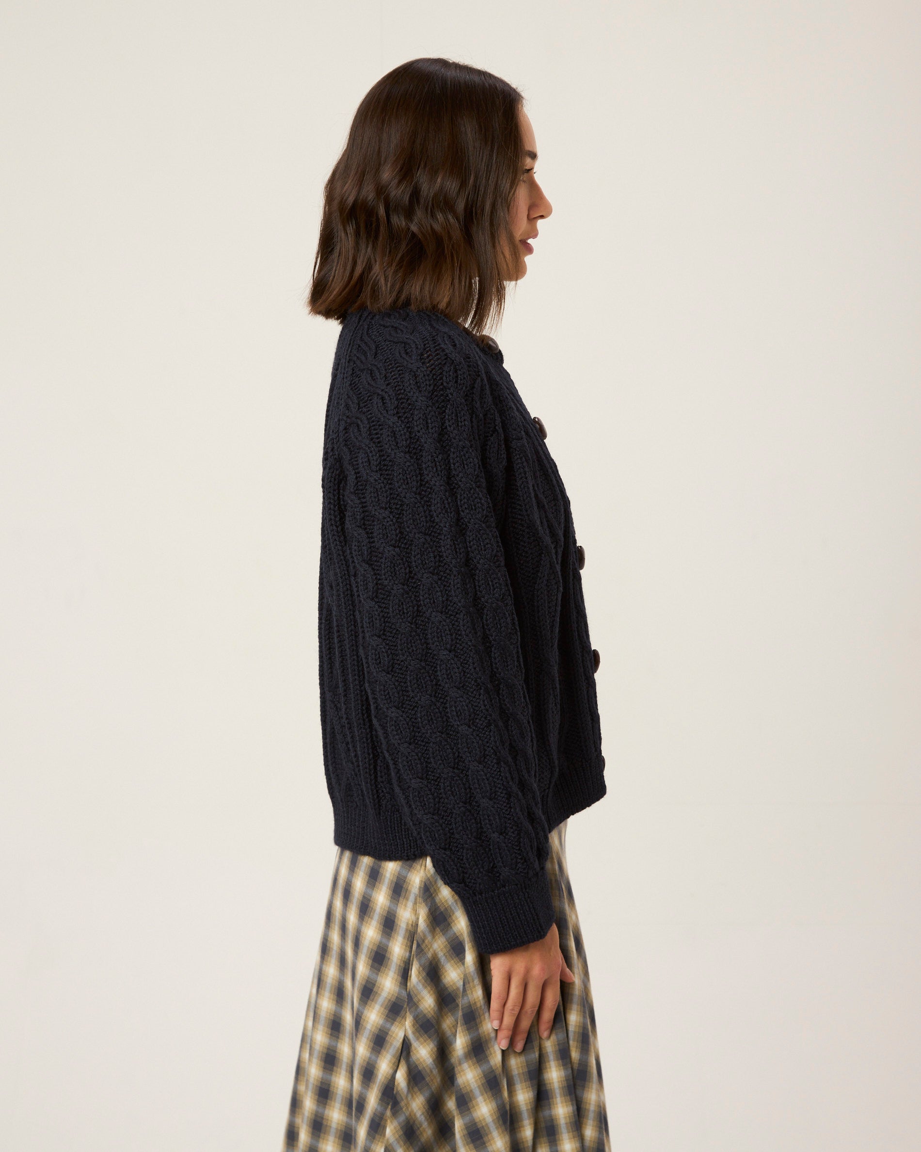 Image of model wearing Beckett Cable Knit Cardigan. 