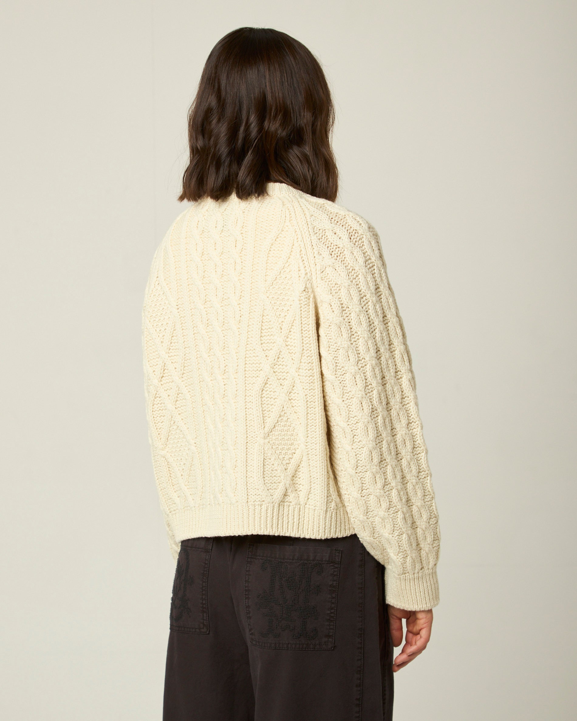 Image of model wearing Beckett Cable Knit Cardigan. 