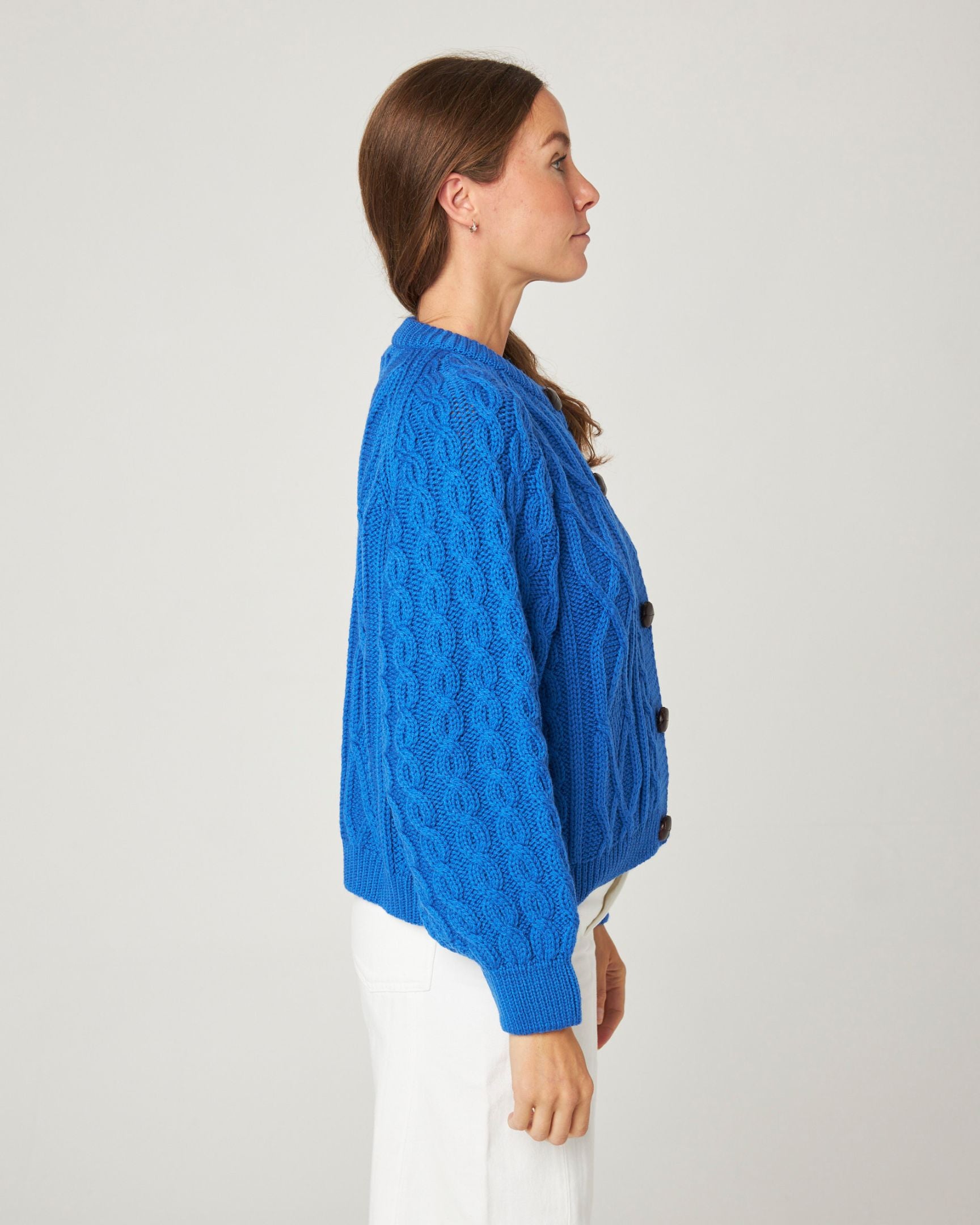 Image of model wearing Beckett Cable Knit Cardigan. 
