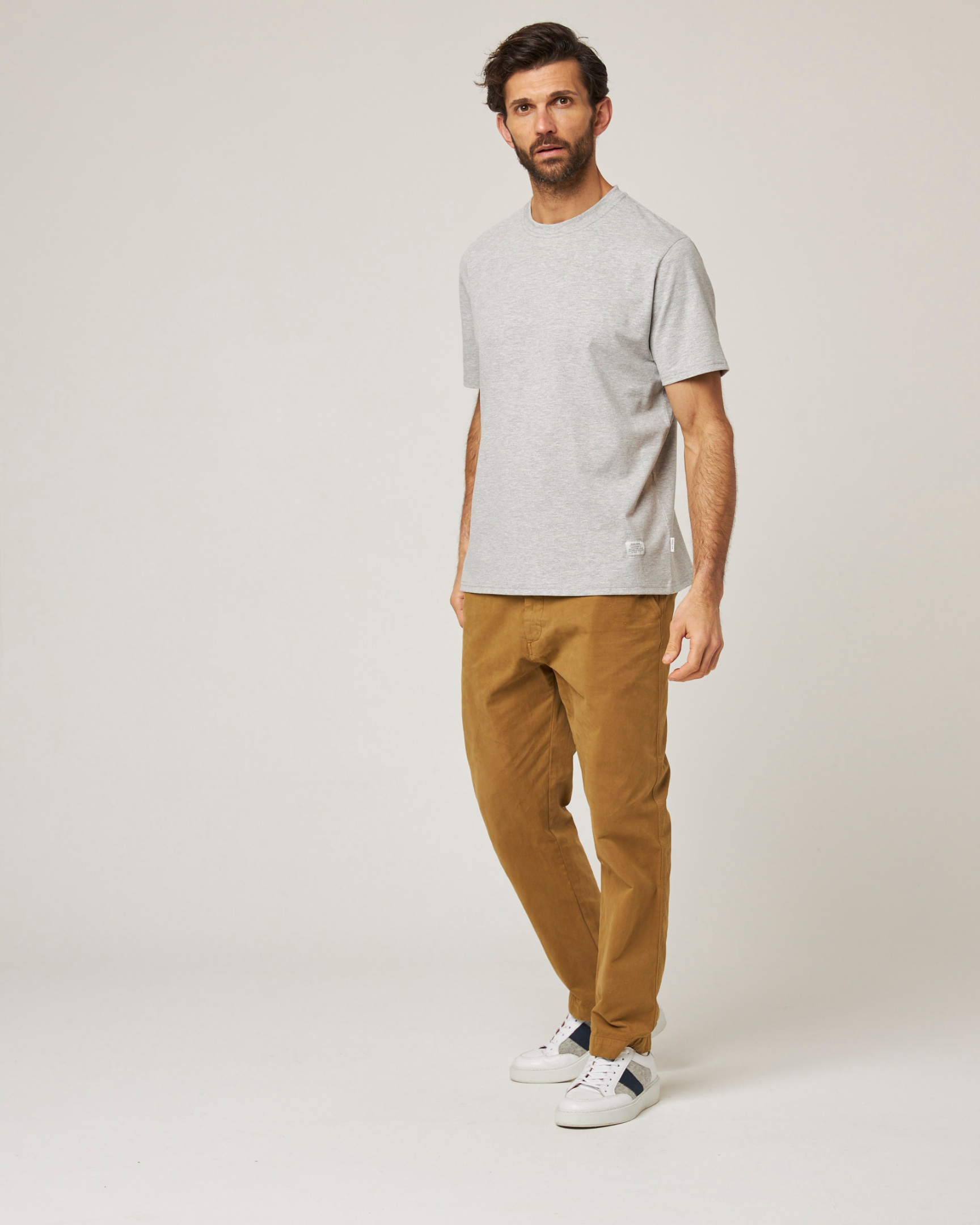 Image of model wearing Classic T-Shirt. Model is 6ft, chest size 36in and wearing size Medium