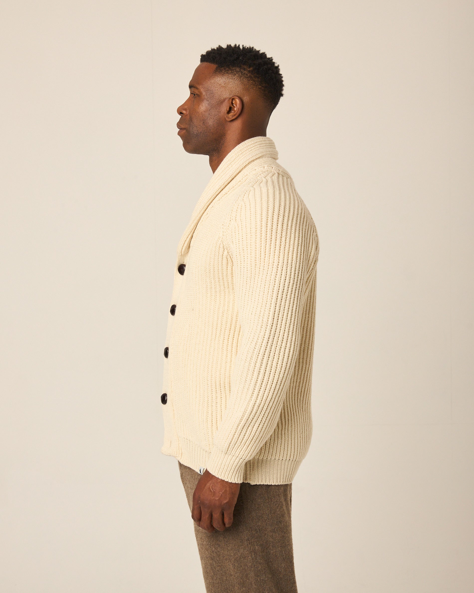 Image of model wearing Wilkinson Cardigan. Model is 6ft1in, chest size 38in and wearing size Large