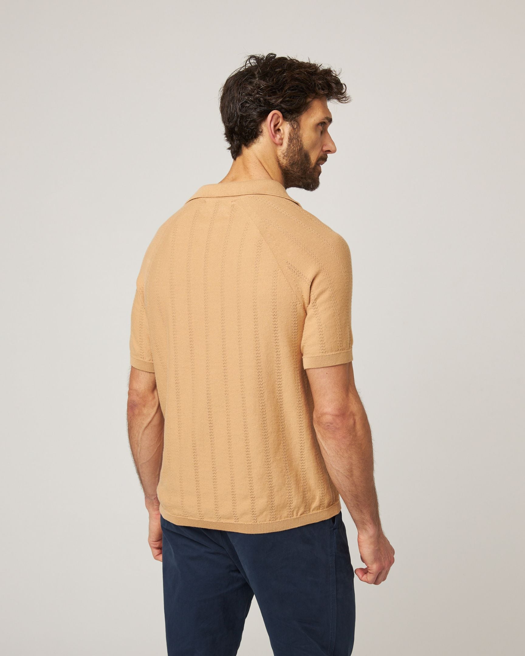 Image of model wearing Alma Polo shirt. 