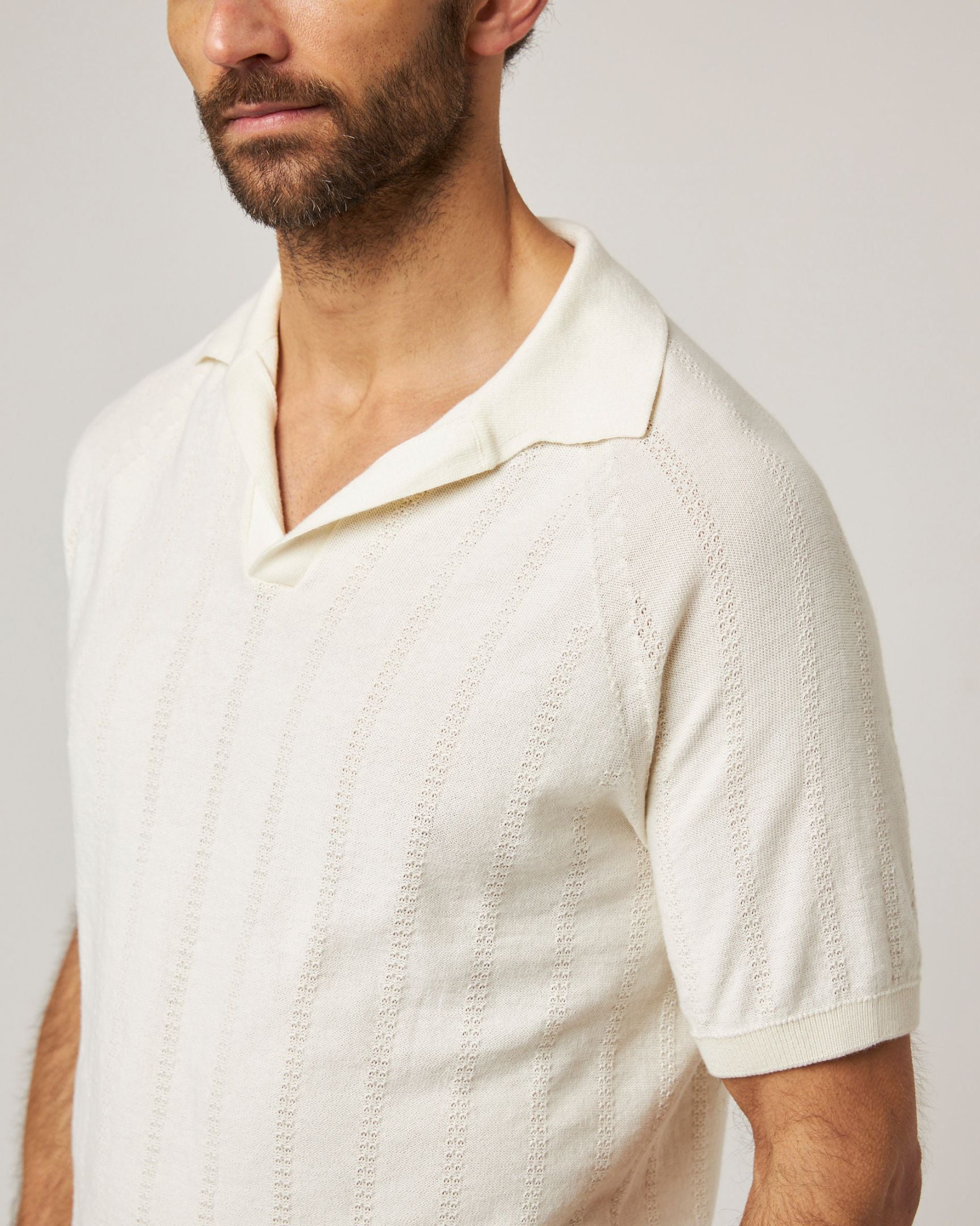 Image of model wearing Alma Polo shirt. 